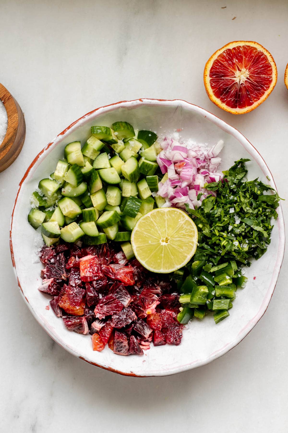 ingredients for blood orange salsa in a white bowl