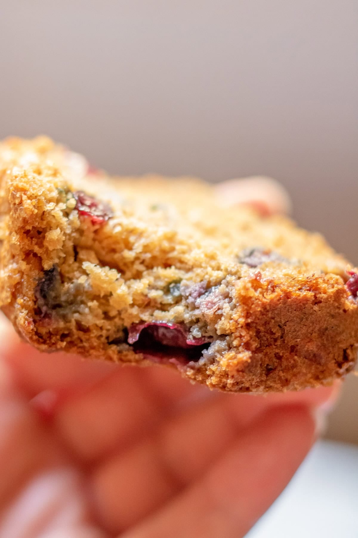 close up of a slice of blueberry banana bread