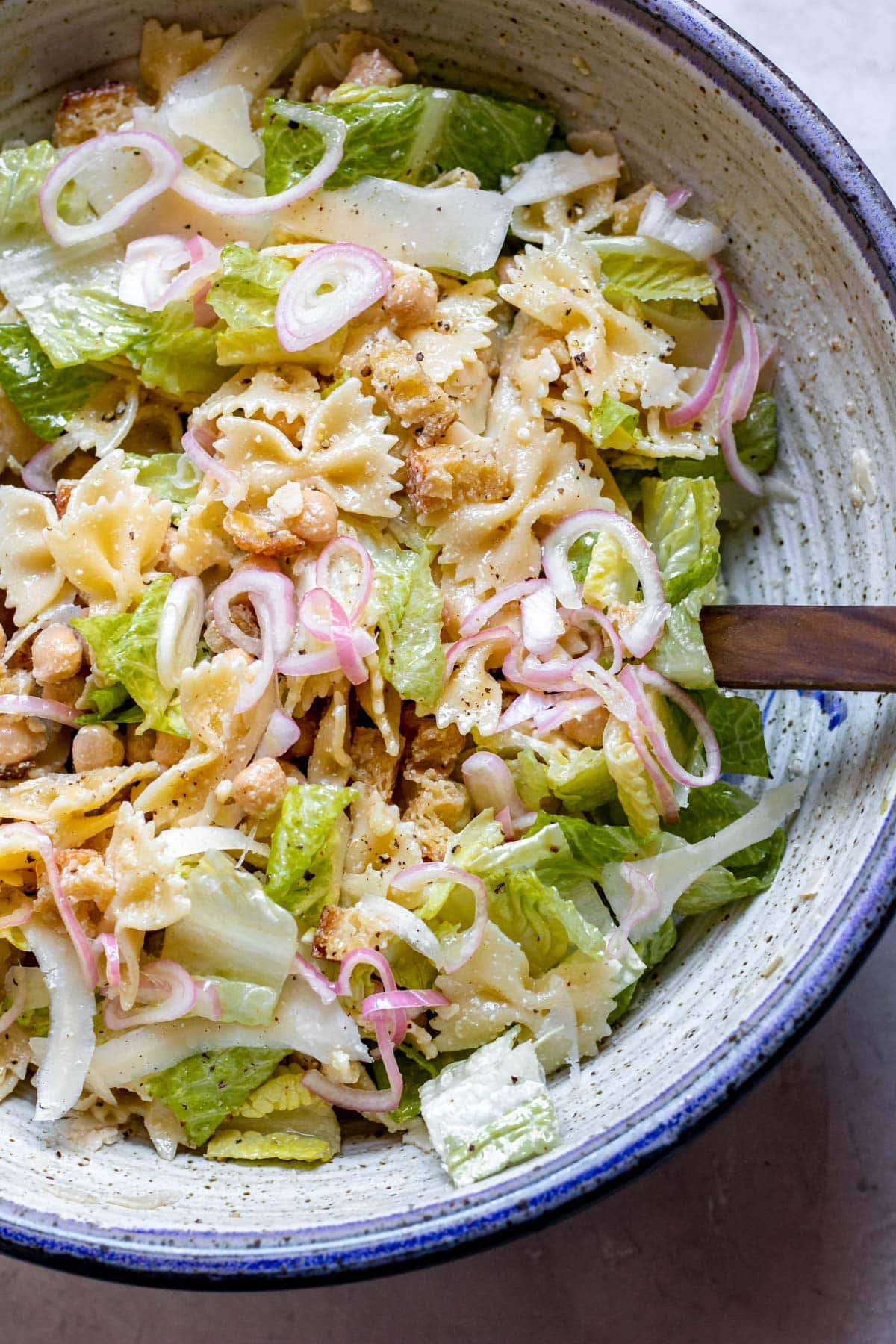 Chickpea Caesar Pasta Salad in a purple bowl