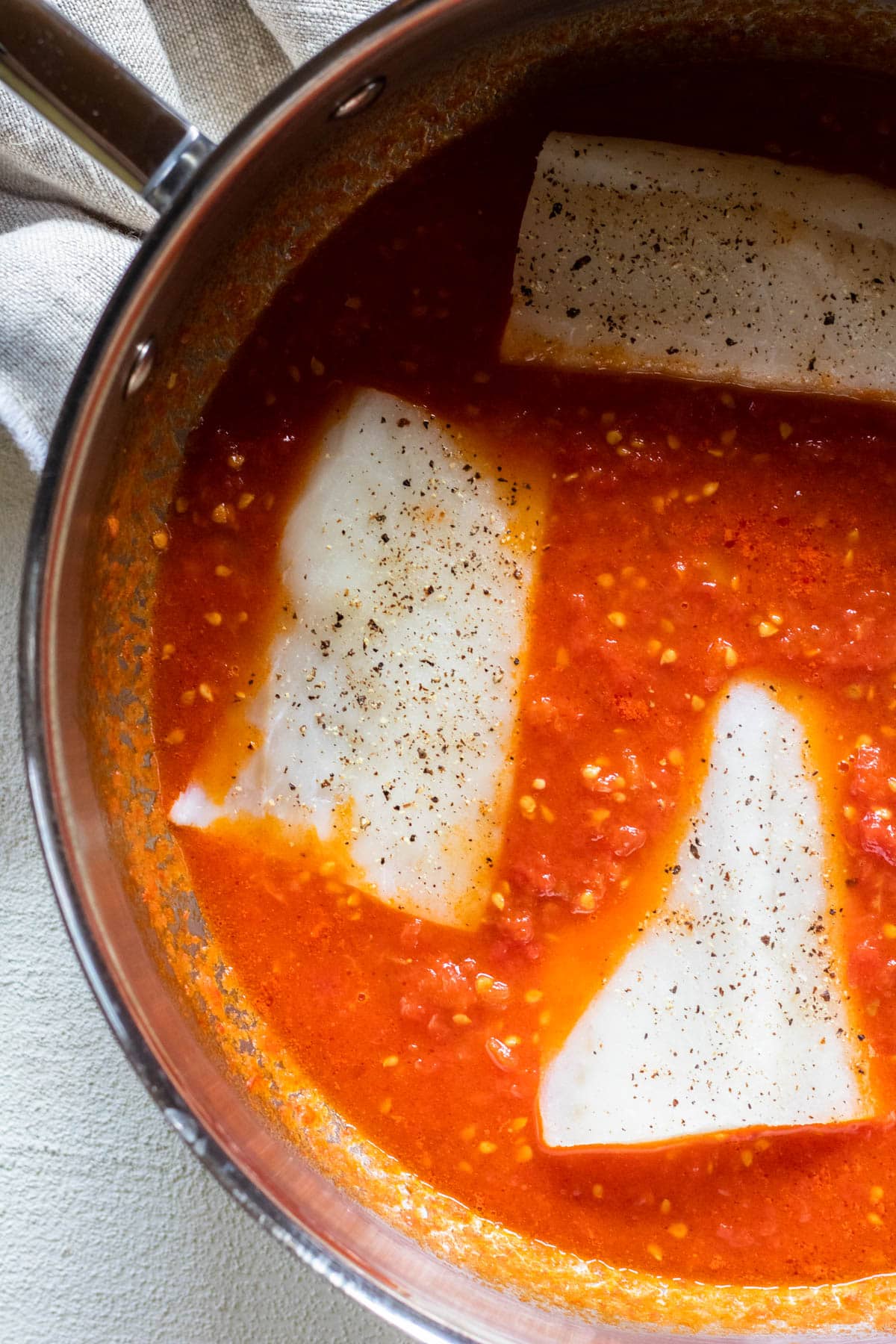 cod pieces added to the sauce