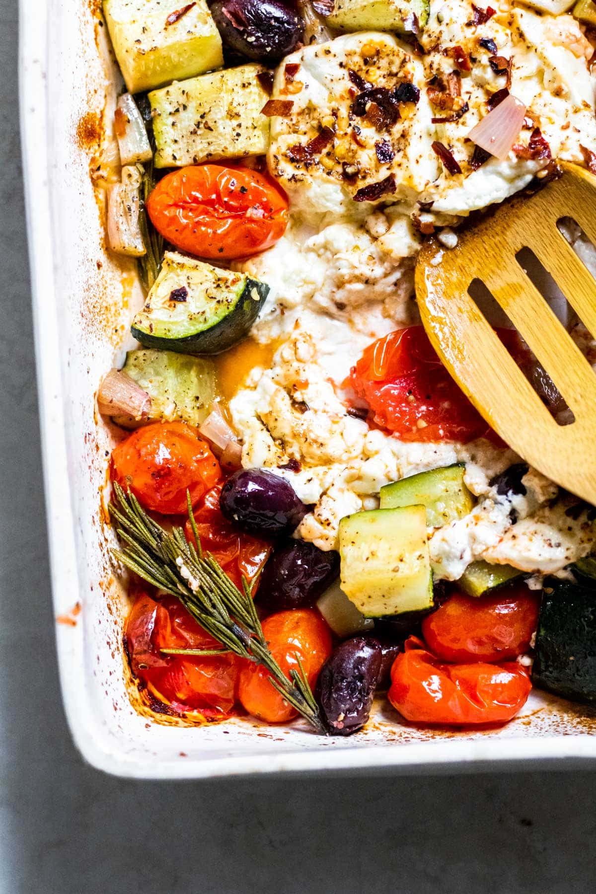 close up of Baked Feta and veggies in a baking dish