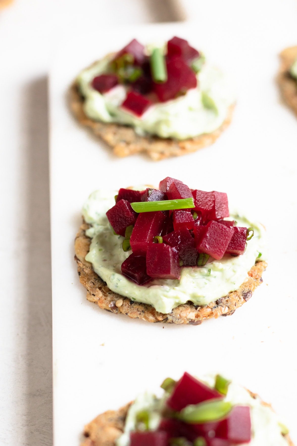 close up of crackers with dip on top