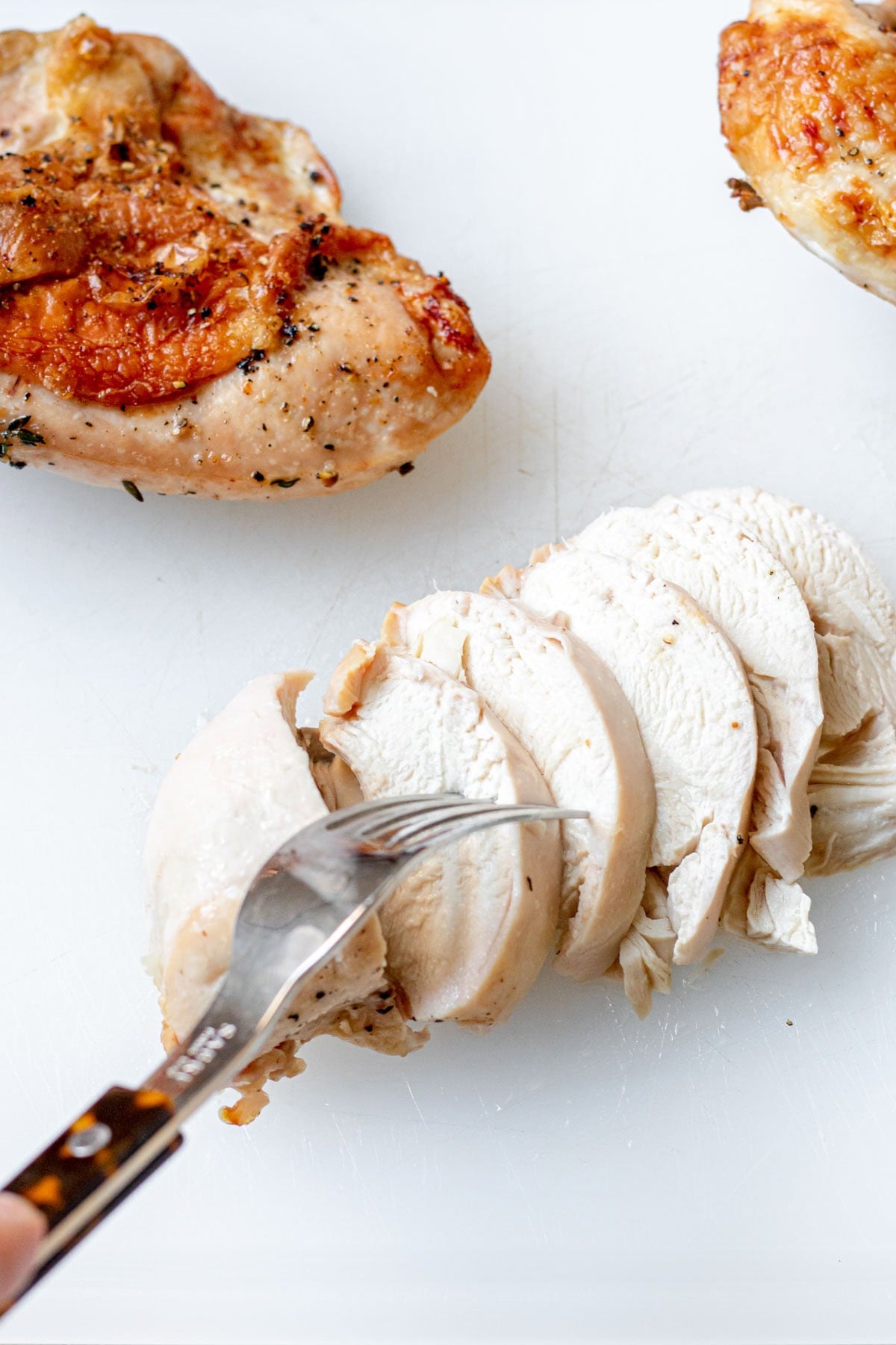 close up of a sliced Roasted Split Chicken Breast