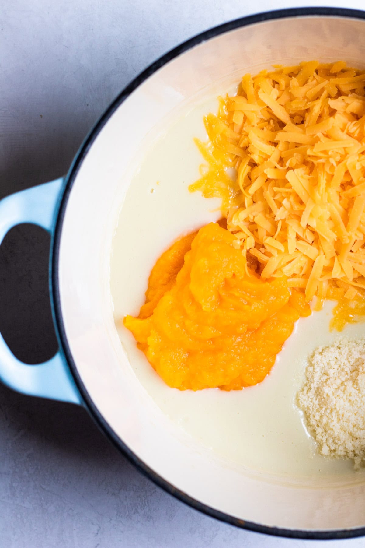 adding ingredients to a medium saucepan