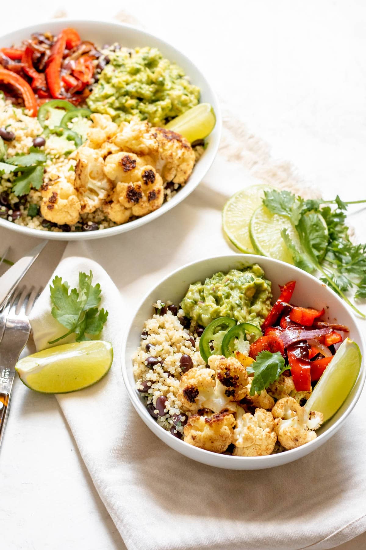 two bowls of Spicy Cauliflower Burrito Bowl with Quinoa