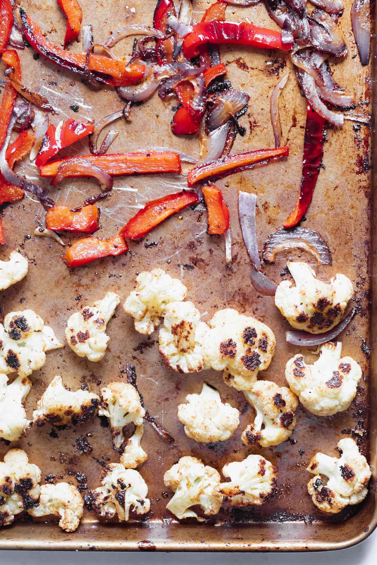 roasted vegetables in a sheet pan