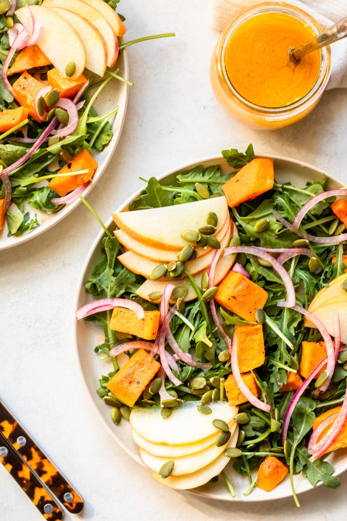 two bowls of Fall Harvest Salad on a white plate