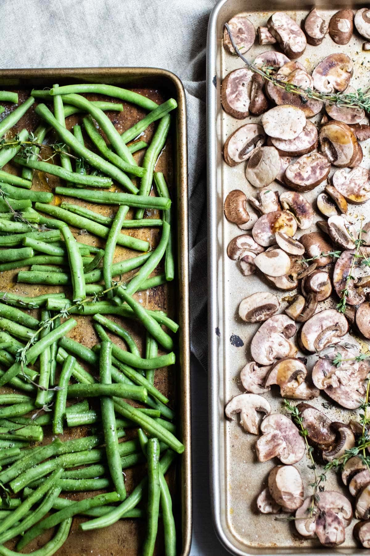 green beans and mushroom slices in two separate sheet trays