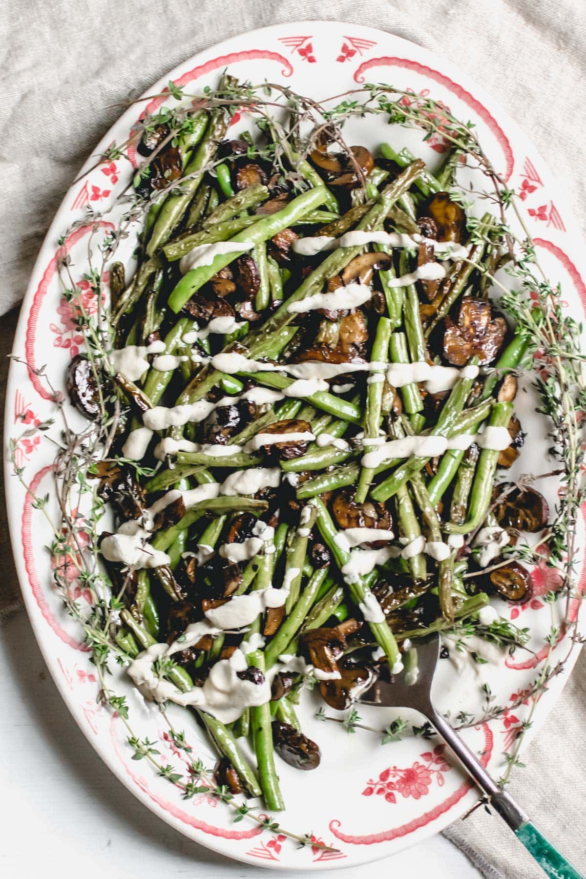 Roasted Green Beans and Mushrooms with creamy onion sauce drizzled on top