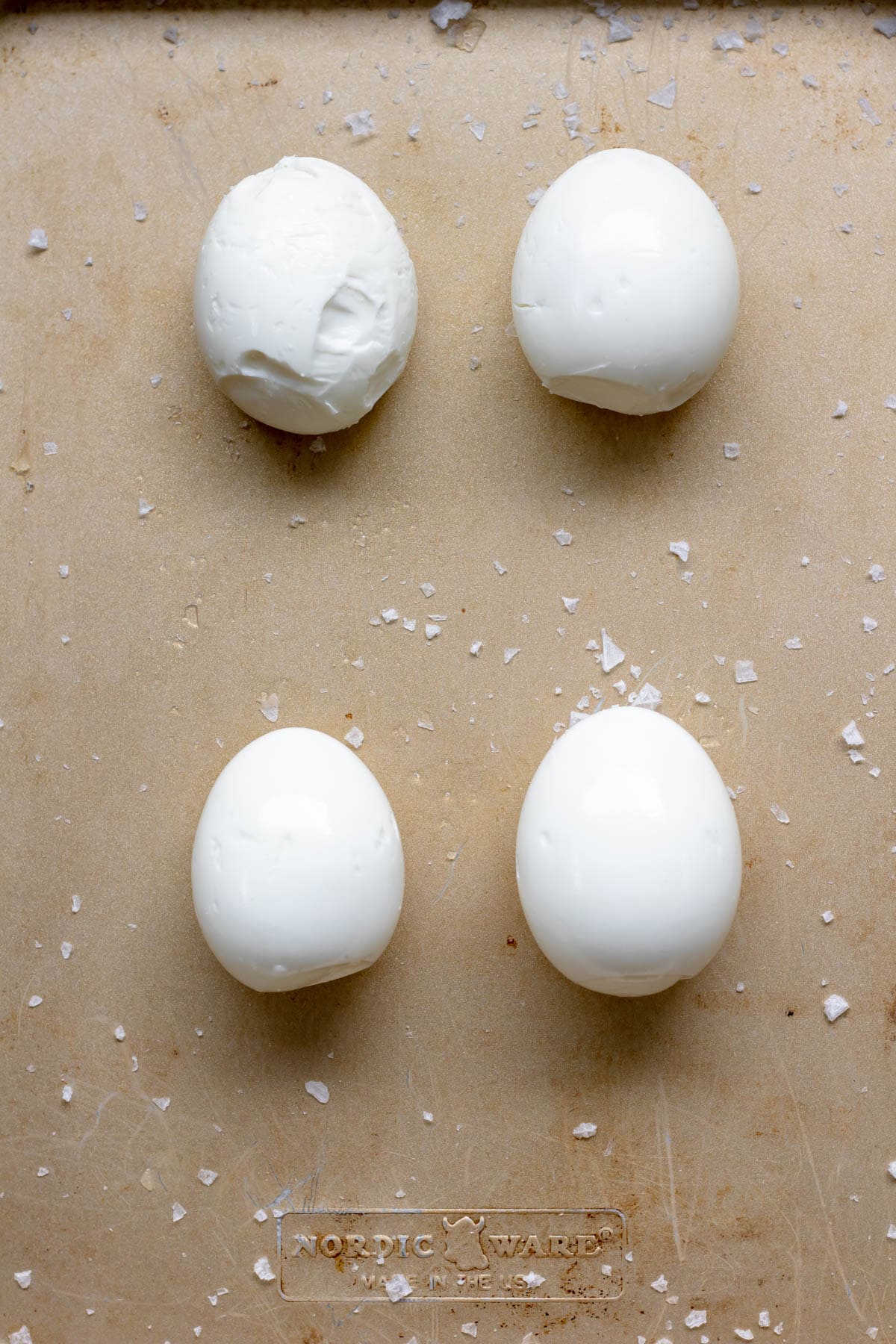 four peeled soft boiled eggs