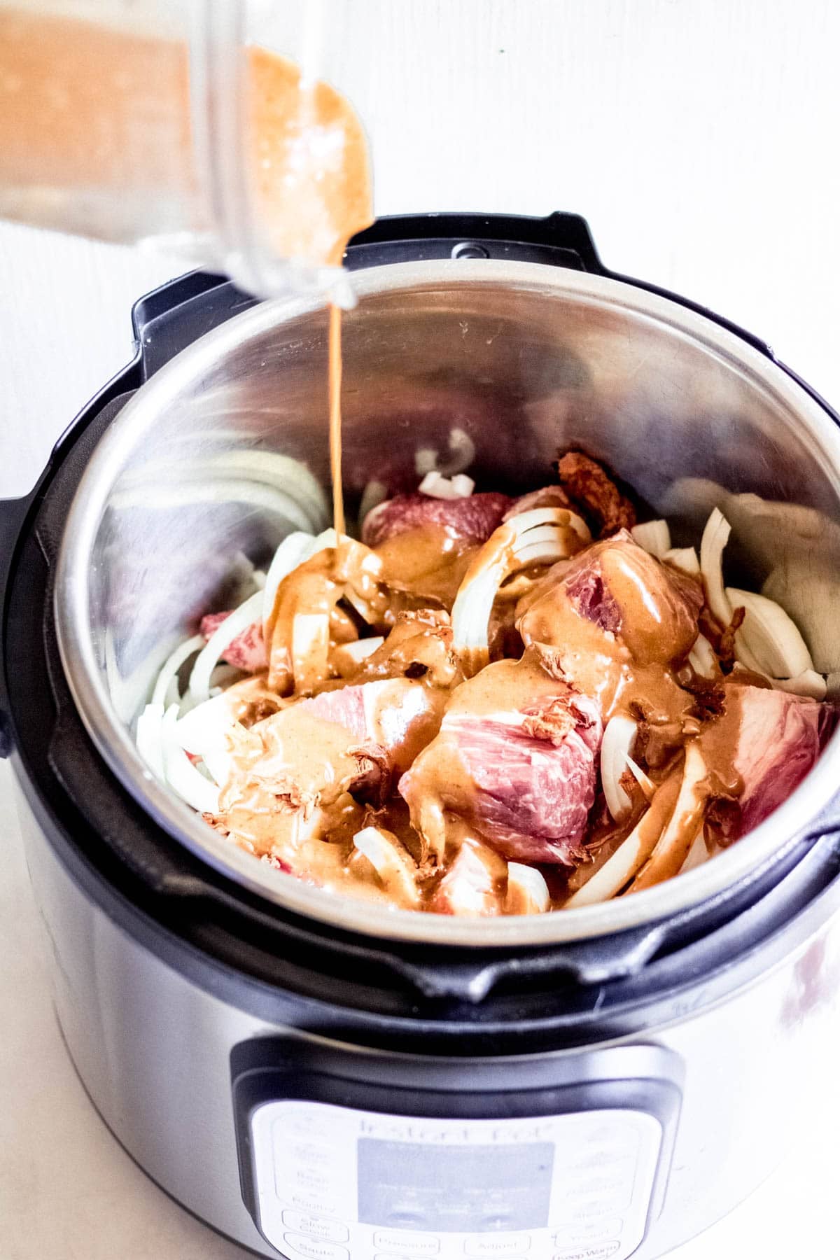 pouring marinade into instant pot