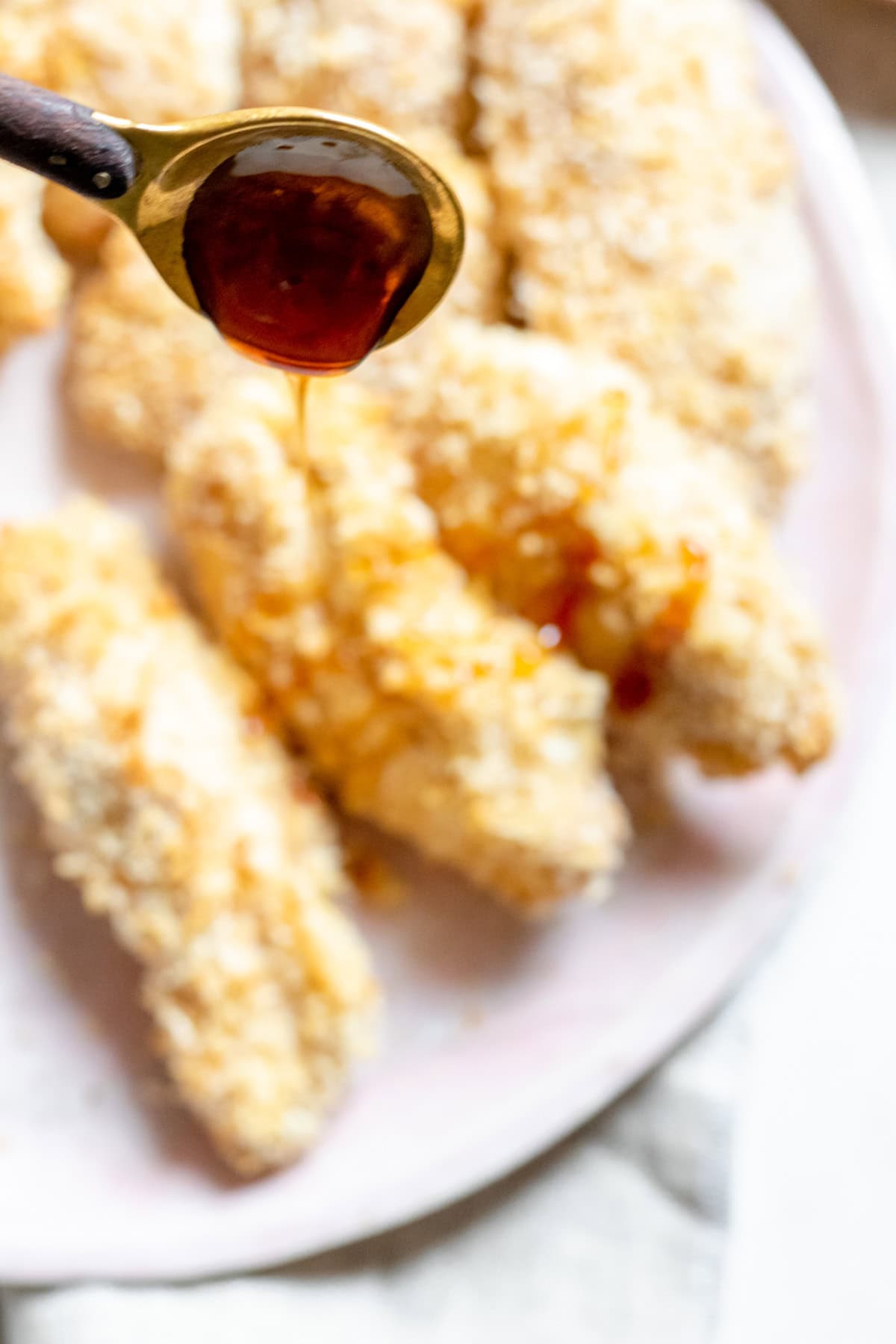 pouring hot chicken spice sauce