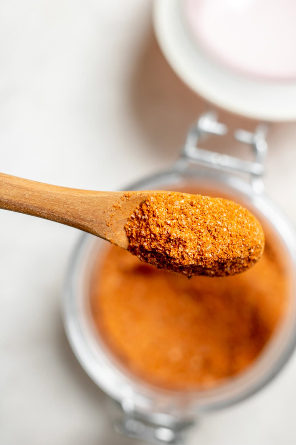 a spoonful of spice in a jar