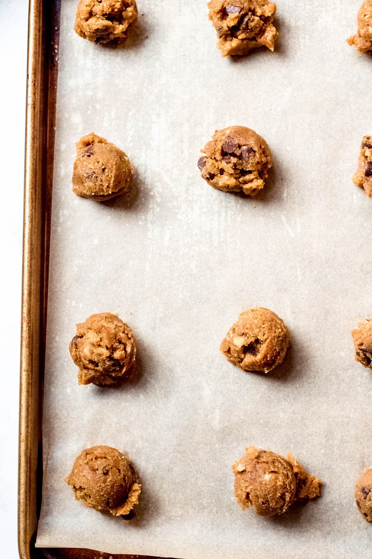almond flour cookie dough balls on a baking sheet