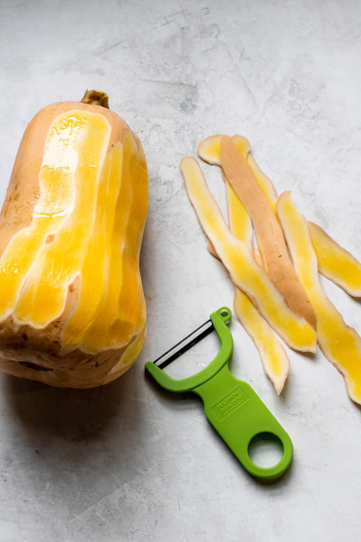 peeling butternut squash