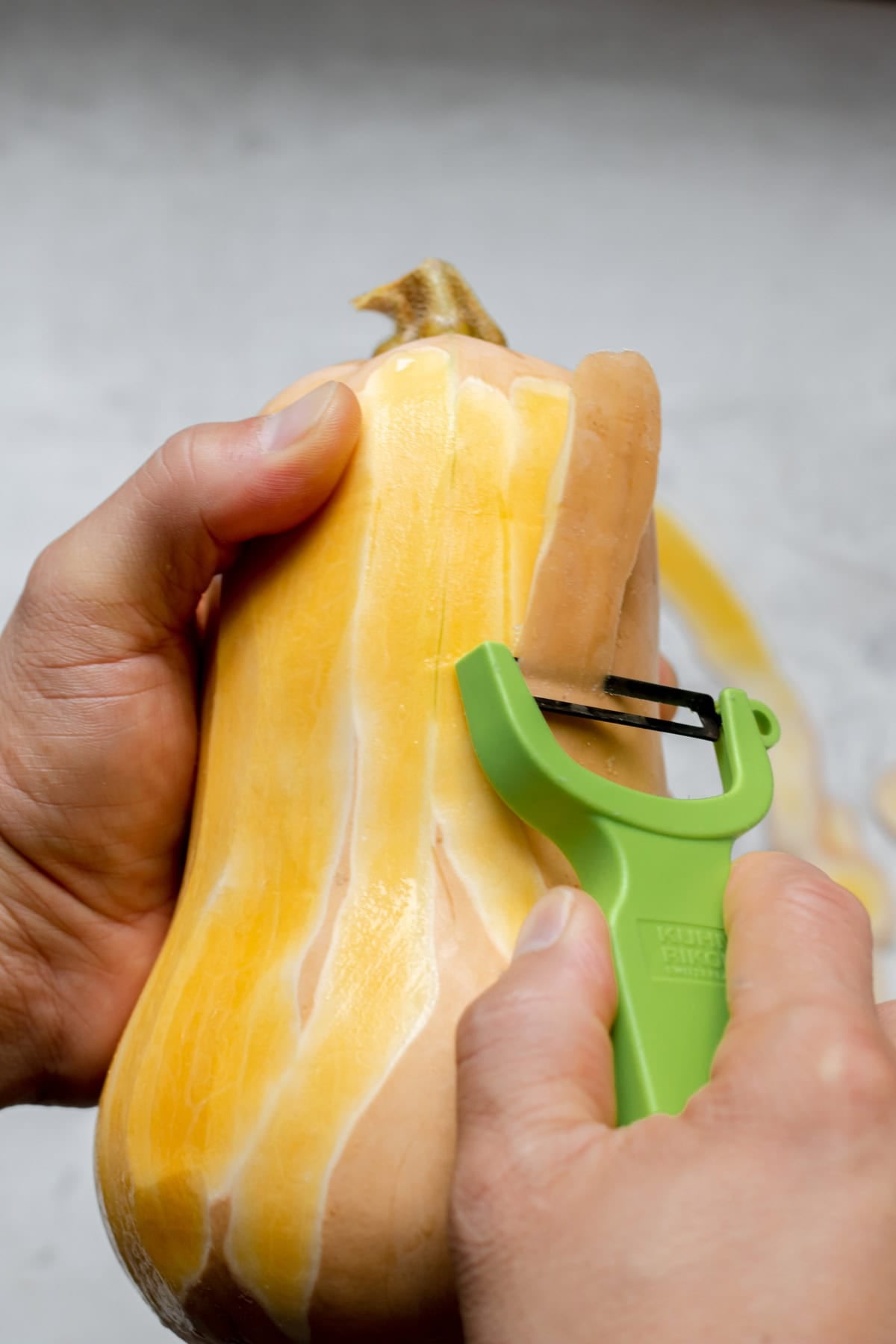 peeling a butternut squash
