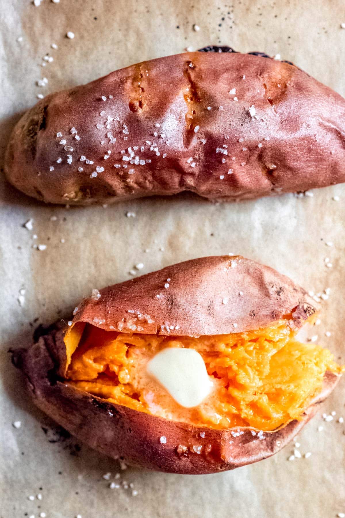 halved sweet potato with a piece of butter inside