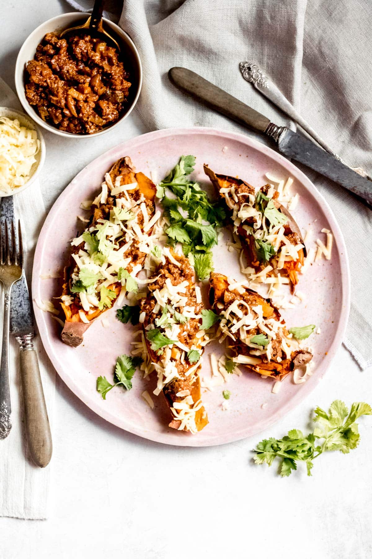 four stuffed sweet potatoes on a plate