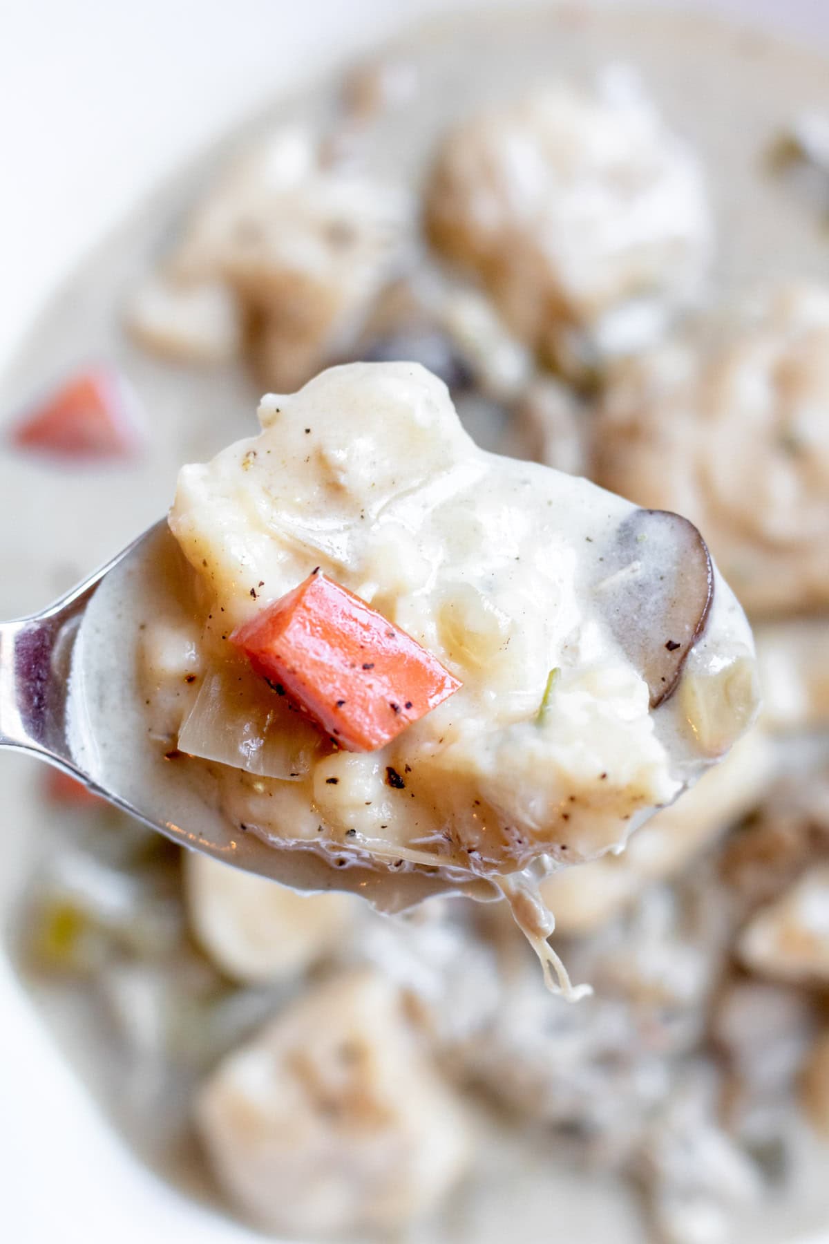 close up of a dumpling in a spoon