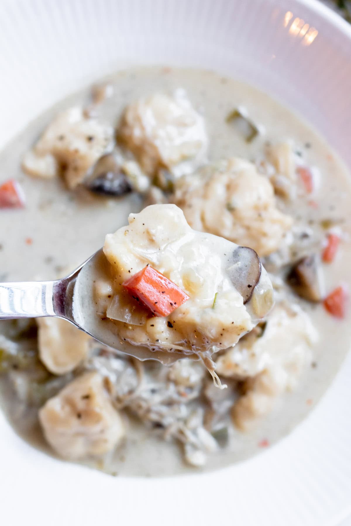 close up of a dumpling in a spoon