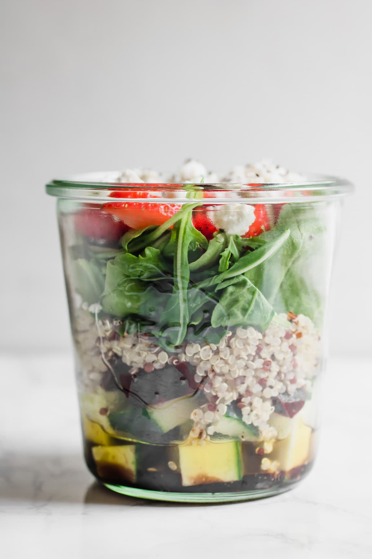 arugula salad in meal prep jar