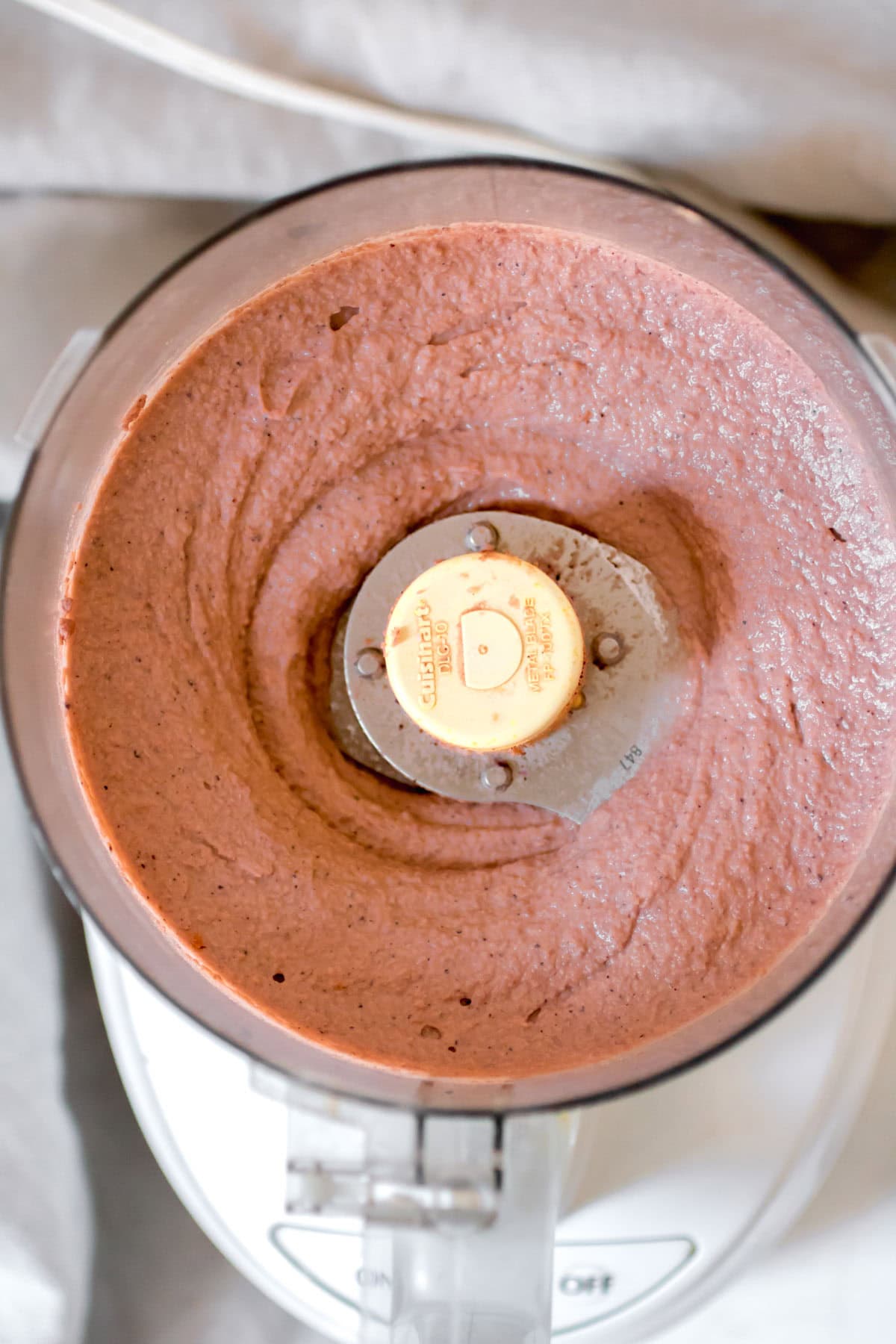 blended ingredients for hummus in a food processor