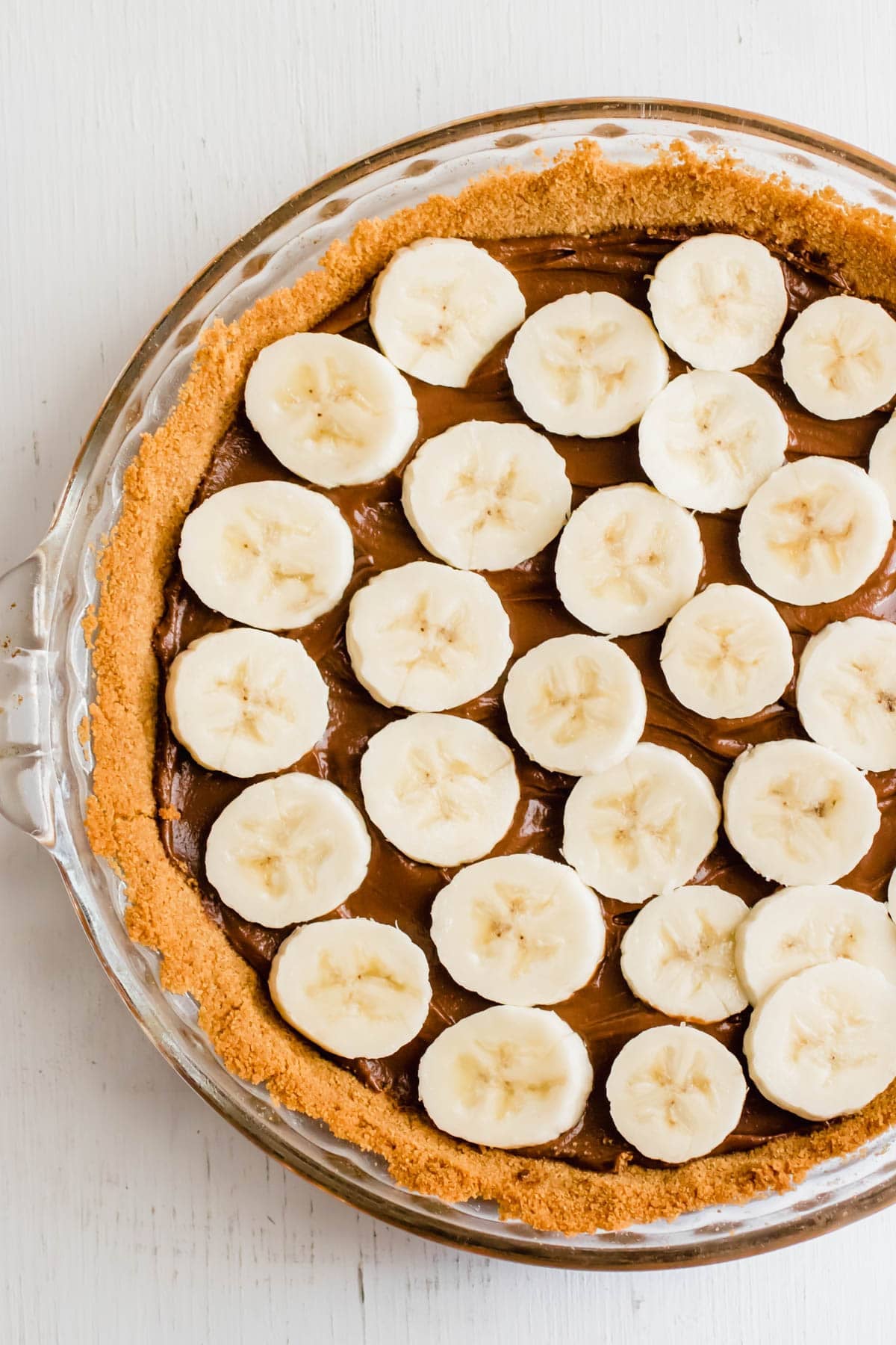 banana slices on top of avocado chocolate pudding