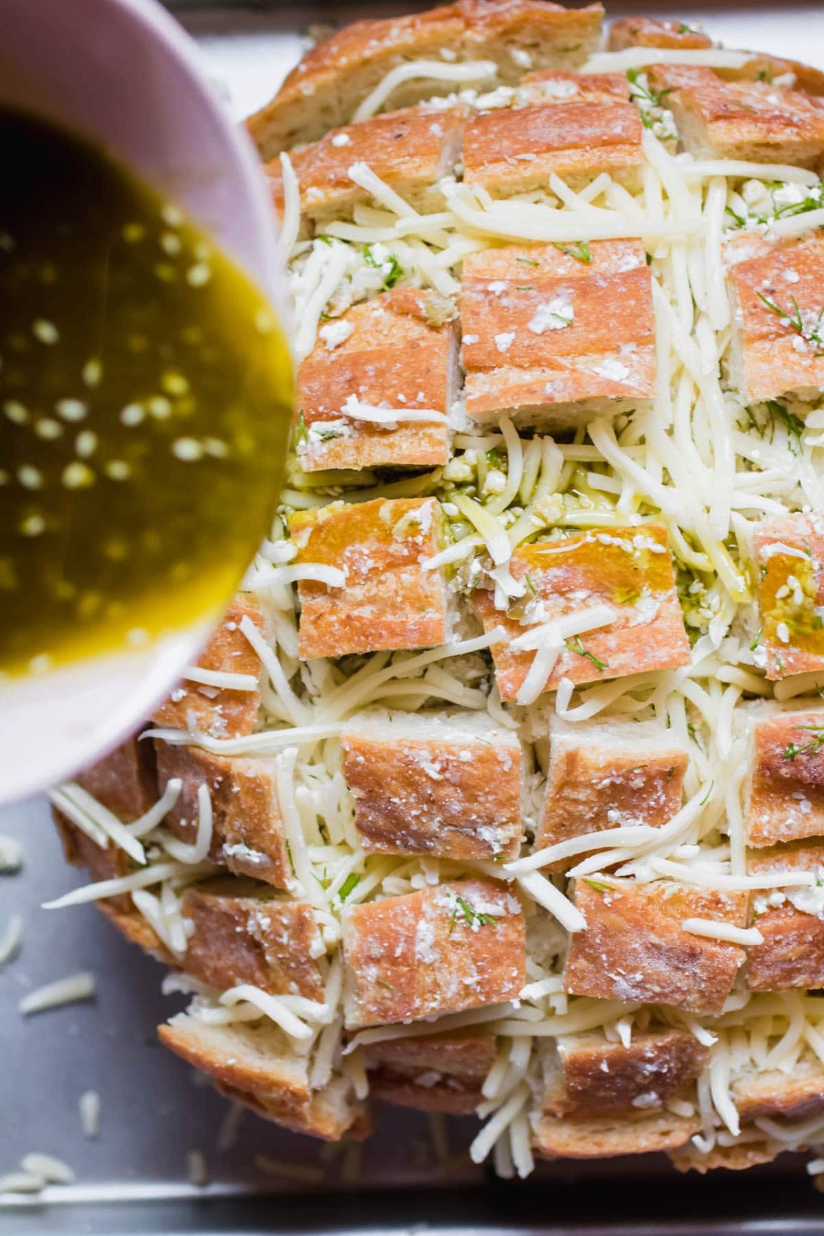 pouring mixture onto sliced bread
