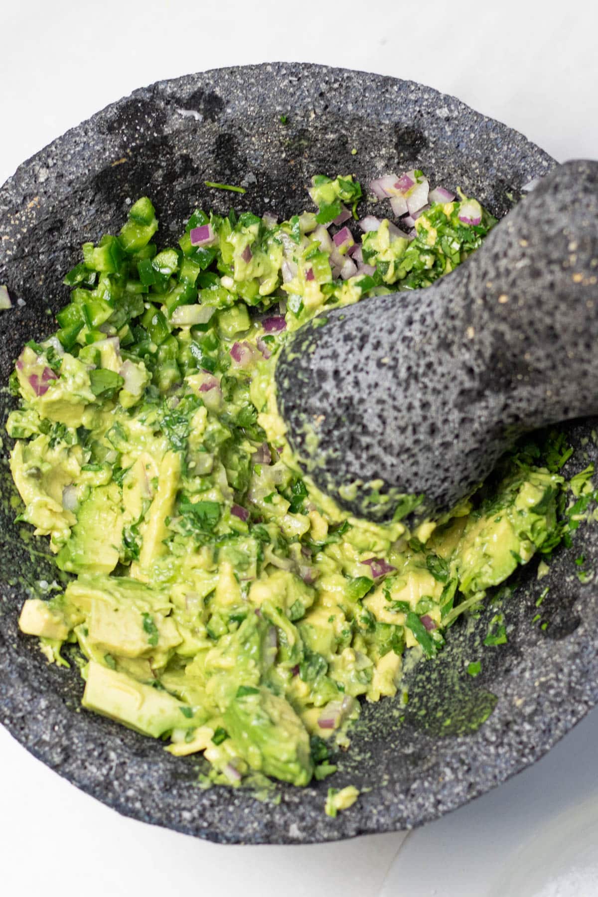 smashing ingredients in a mortar