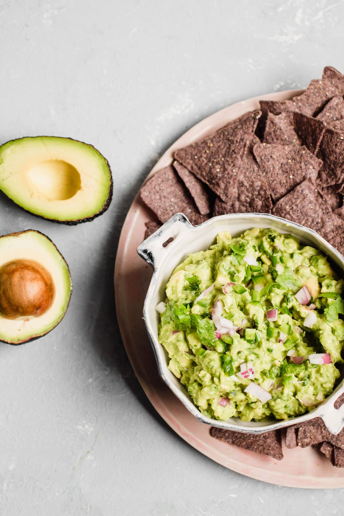healthy guacamole with tortilla chips on the side