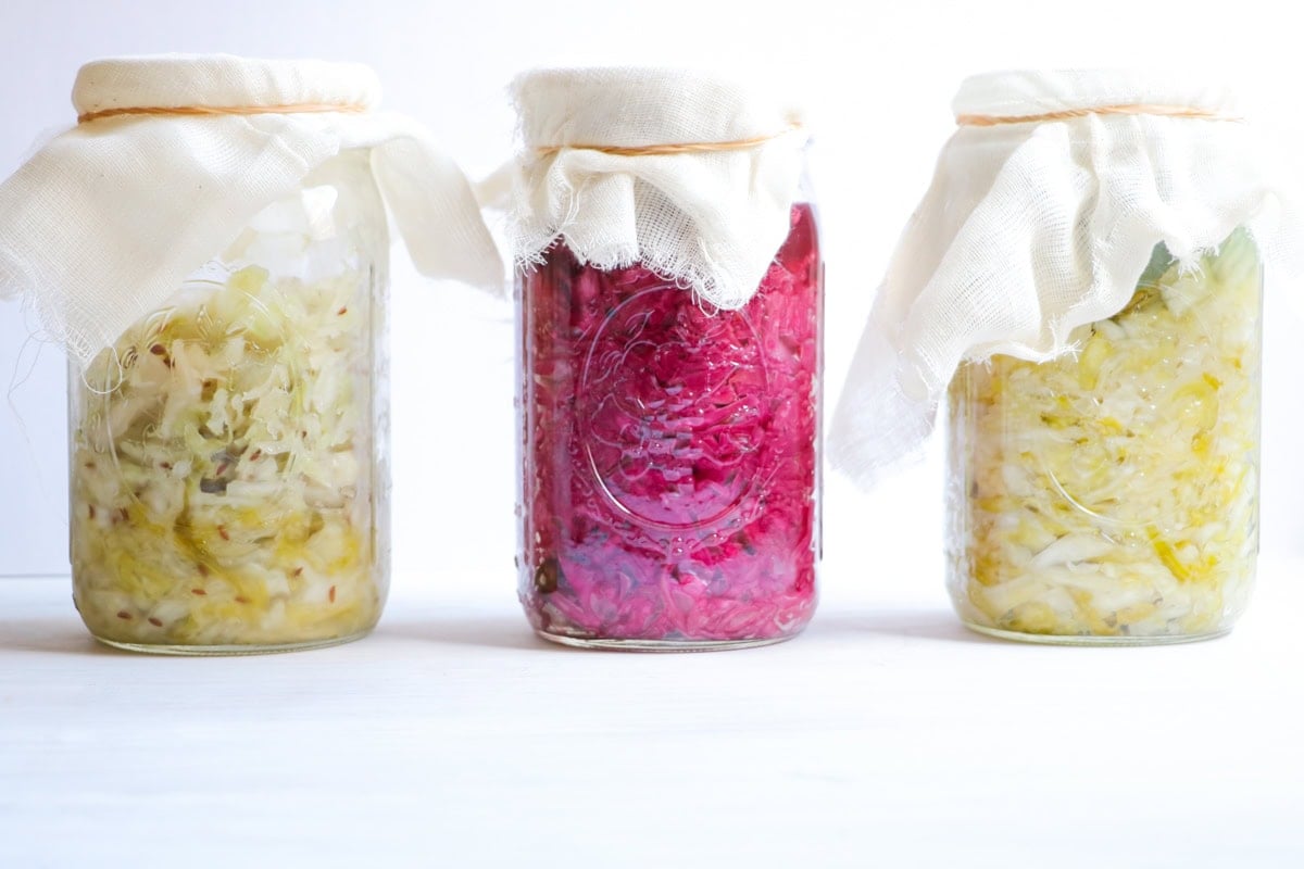 three mason jars of Sauerkraut