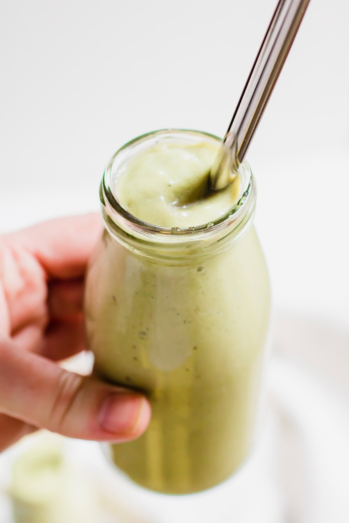 hand holding smoothie