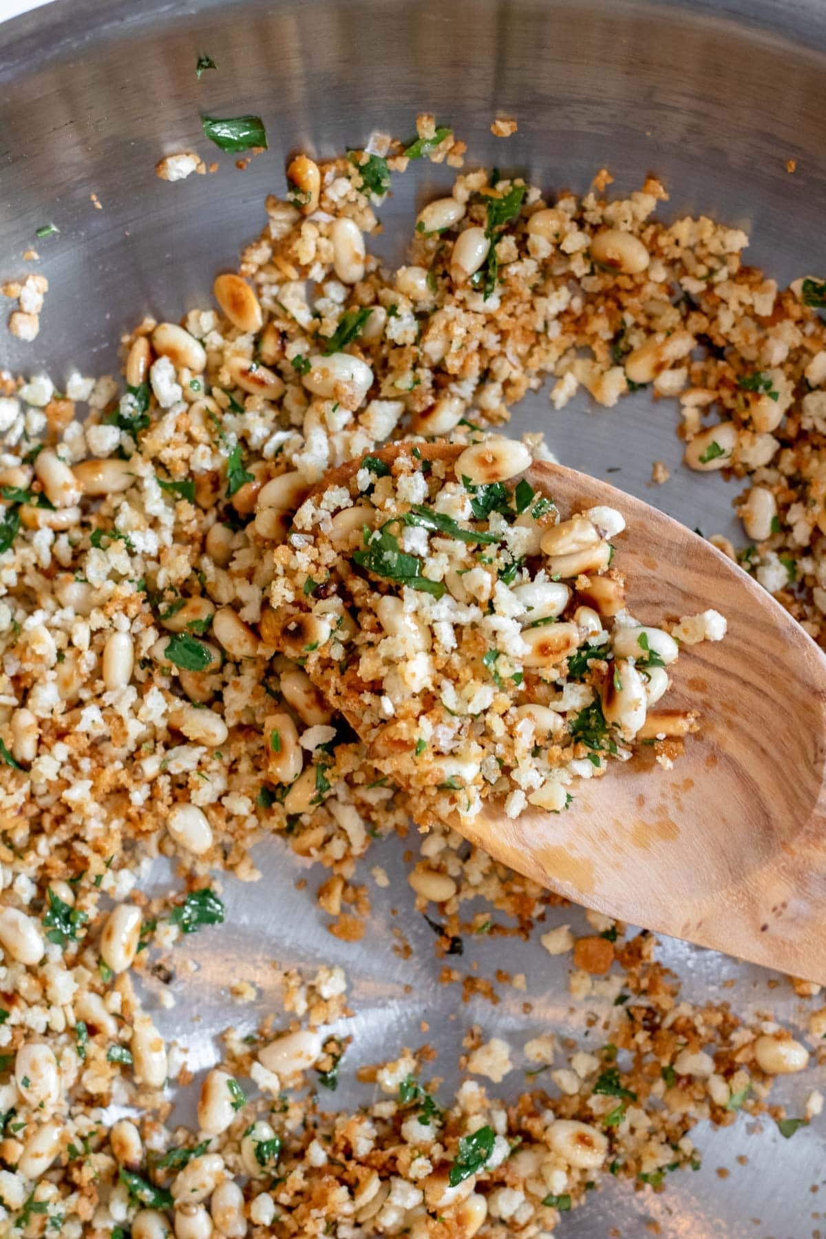 toasted pine nuts, breadcrumbs and fresh herbs in a pan
