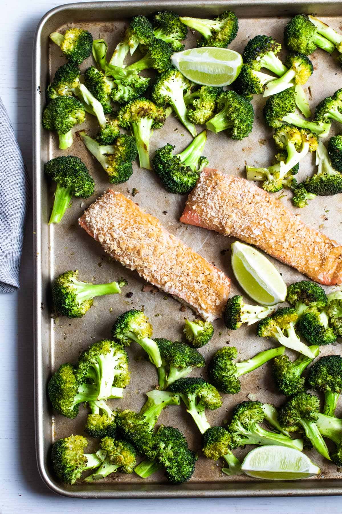salmon filets and roasted broccoli on a sheet pan