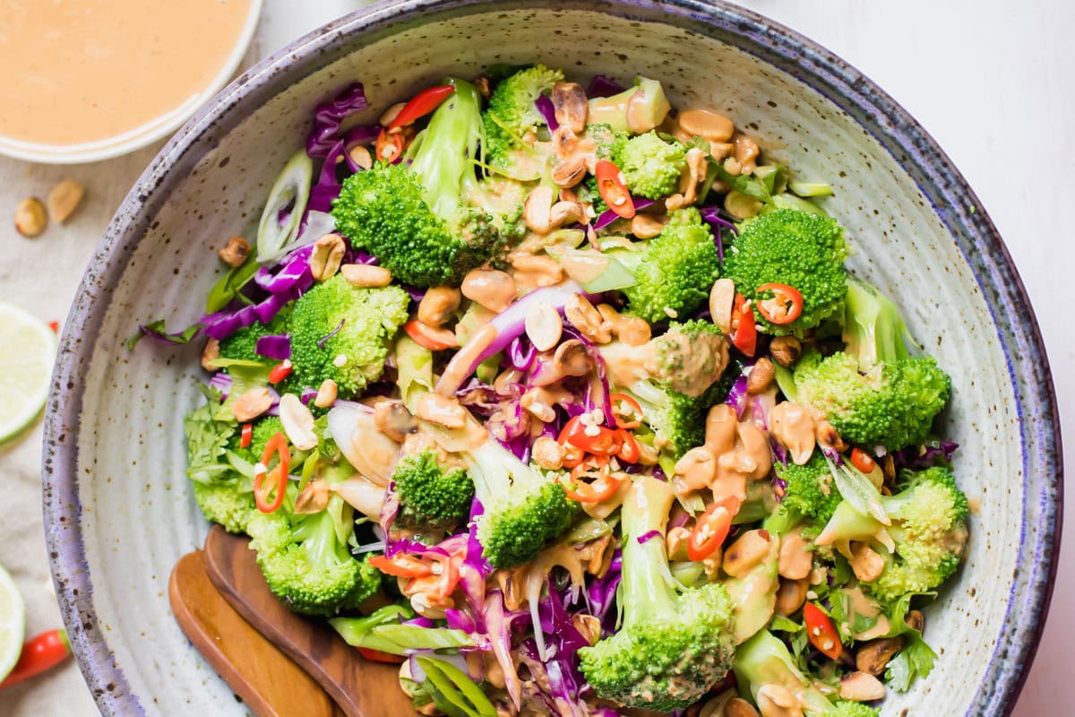 top down view of salad with dressing in a bowl