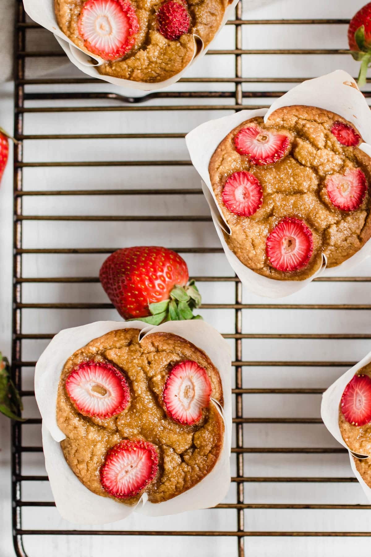 strawberry muffins on a cooling rack