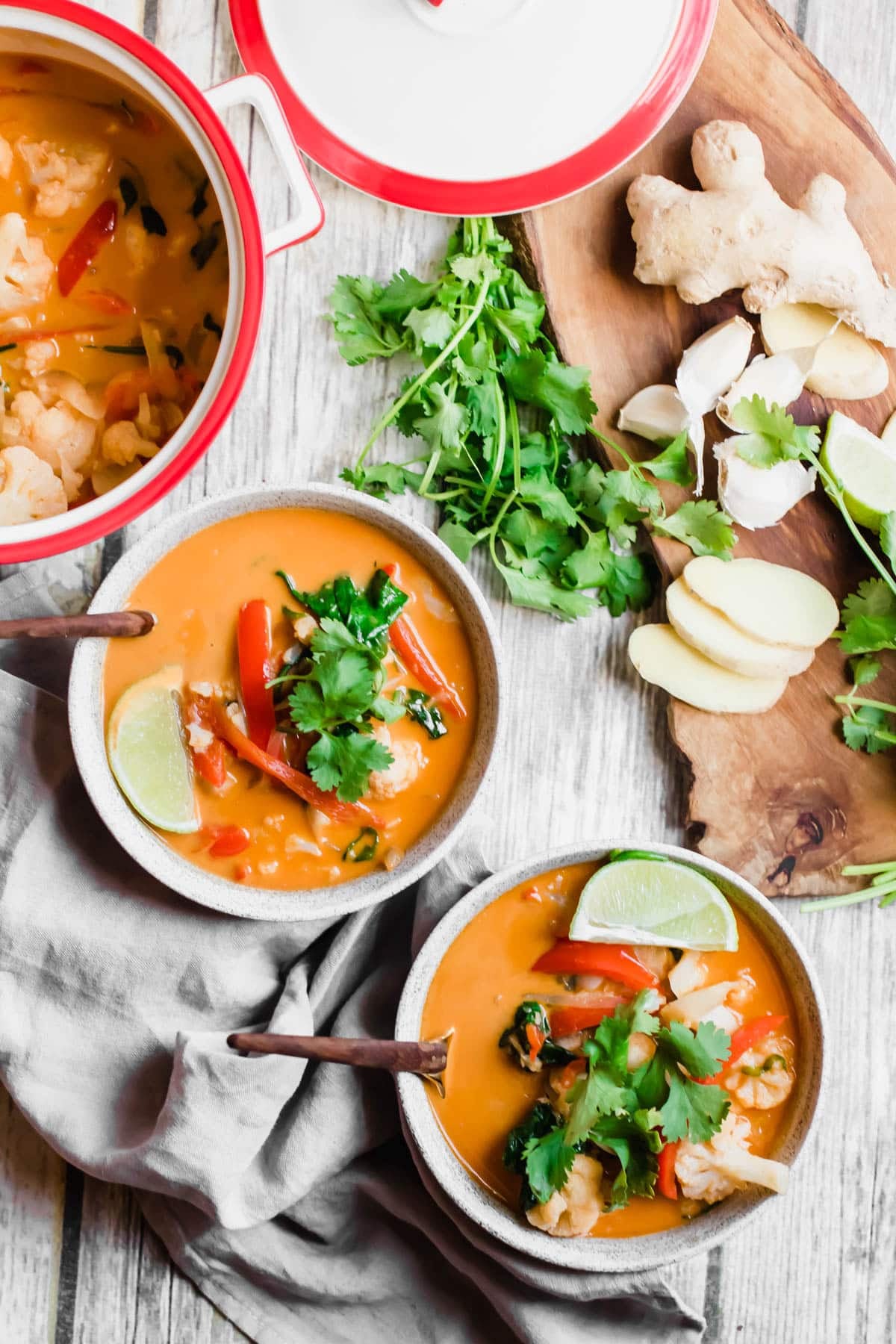 bowls of curry with toppings