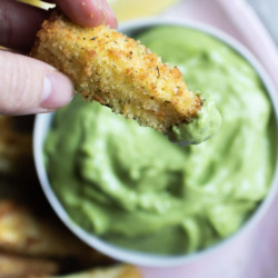 Crispy zucchini fries baked in the air fryer. A gluten-free, paleo version plus a more traditional bread crumb version. A crispy healthy snack, ready in 15 minutes!