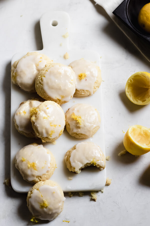 Lemon Cream Cheese Cookies with Almond Flour with lemons on a white board