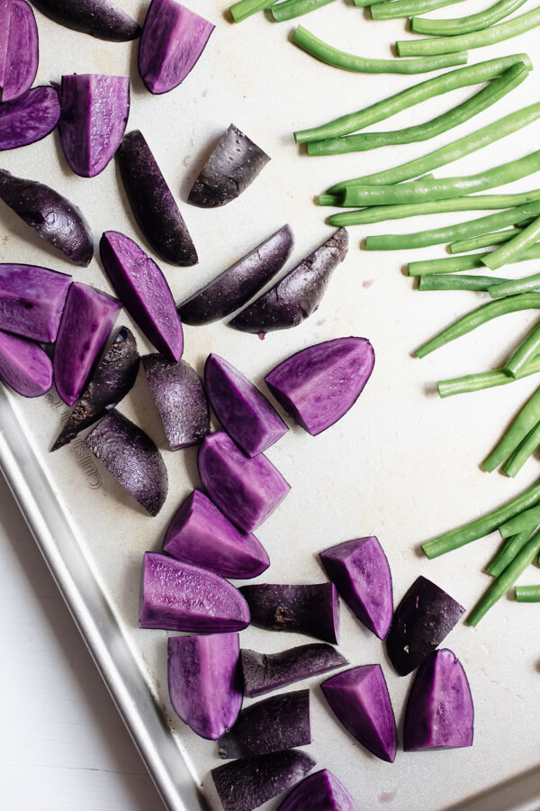 Sheet Pan Mini Meatloaves with purple potatoes and green beans, your busy weeknight healthy dinner savior. Delicious nourishing comfort food cooked on one pan for easy cleanup! 