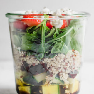 Light and delicious Beet and Arugula Jar Salad with Strawberries and Goat Cheese. Paired with a tangy simple balsamic vinaigrette. This healthy delicious and convenient salad is packed with arugula, cucumber, beets, quinoa, strawberry, goat cheese, and chia seeds. The perfect quick and easy portable lunch!