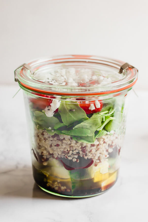 Light and delicious Beet and Arugula Jar Salad with Strawberries and Goat Cheese. Paired with a tangy simple balsamic vinaigrette. This healthy delicious and convenient salad is packed with arugula, cucumber, beets, quinoa, strawberry, goat cheese, and chia seeds. The perfect quick and easy portable lunch!