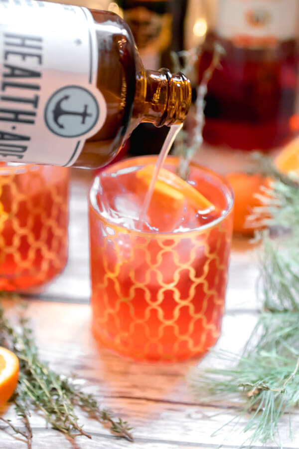 Ring in the holidays with a refreshing and delicious low alcohol cocktail. A twist on a traditional Americana Cocktail using kombucha for a little extra gut health love. The perfect light cocktail for a holiday party!