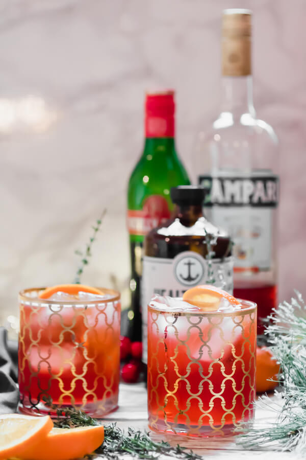 Ring in the holidays with a refreshing and delicious low alcohol cocktail. A twist on a traditional Americana Cocktail using kombucha for a little extra gut health love. The perfect light cocktail for a holiday party!