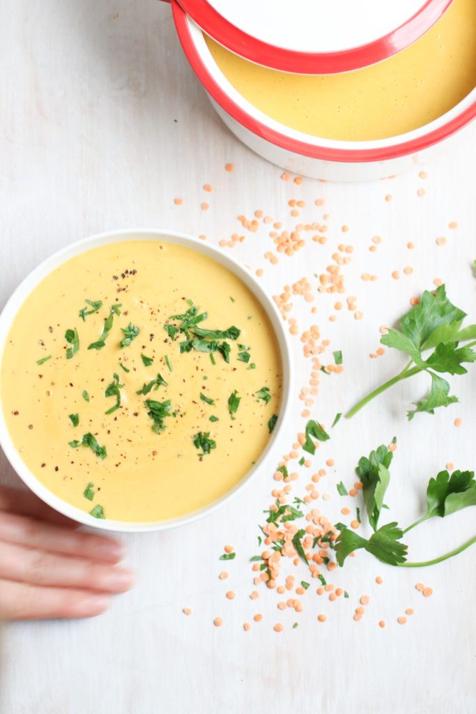 This quick and healthy (vegan) coconut red lentil soup recipe is hearty and deeply satisfying. It is my go-to quick weeknight dinner recipe.
