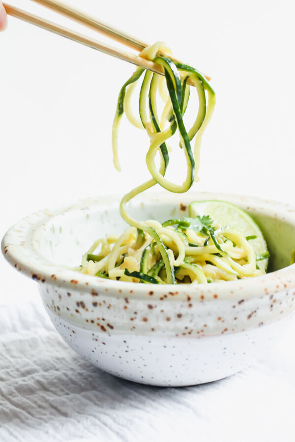 A healthy and delicious recipe for cold peanut zucchini noodles. Only 7 simple ingredients, no cooking required! Just whisk together the most delicious wholesome peanut sauce and toss in some zucchini noodles. Gluten free, paleo, vegan, whole 30 healthy lunch, dinner, or quick snack!