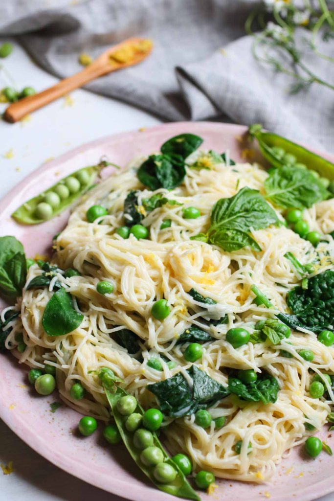 Creamy Vegan Lemon Pasta with Fresh Peas and Spinach, ready in under 30 minutes! Simple to make and full of good for you ingredients.