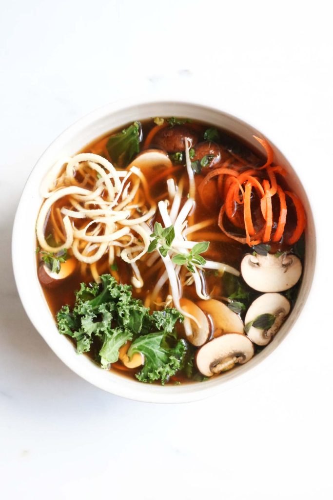 Detoxifying broth bowls with parsnip and carrot noodles is a paleo and gluten free meal that is chocked full of anti-inflammatory, nutrient dense veggies. Healthy, quick, and super yummy! abraskitchen.com