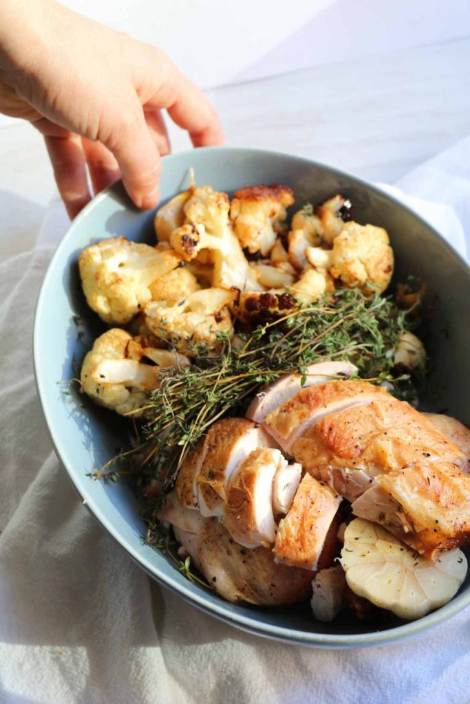 One pan easy garlic thyme roast chicken with cauliflower is the one recipe you need and the only recipe you will ever use for whole roasted chicken. Perfect every time, crispy skin, juicy and flavorful. A complete meal made in a cast iron skillet. 
