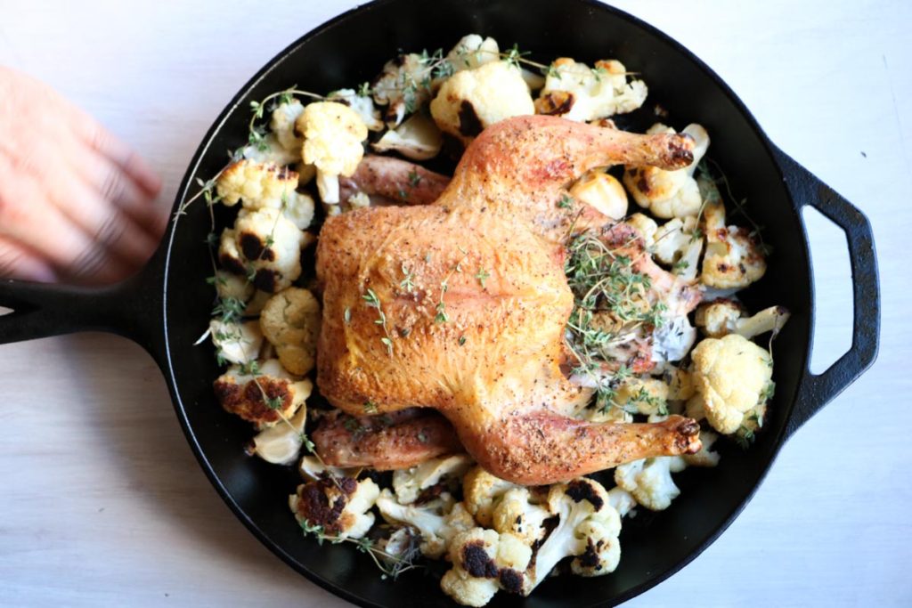 One pan easy garlic thyme roast chicken with cauliflower is the one recipe you need and the only recipe you will ever use for whole roasted chicken. Perfect every time, crispy skin, juicy and flavorful. A complete meal made in a cast iron skillet. 